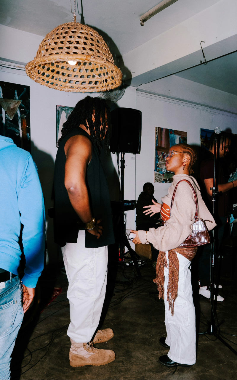 a gathering of people in discussion - Unsplash by Dwayne Joe